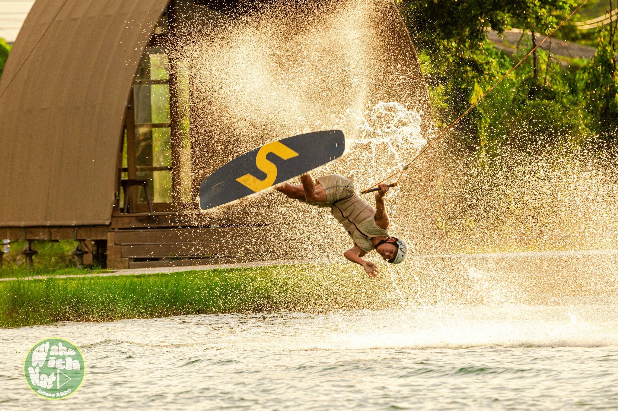 Wakeboarder launching off a kicker at ESC Thai Wake Park Thailand