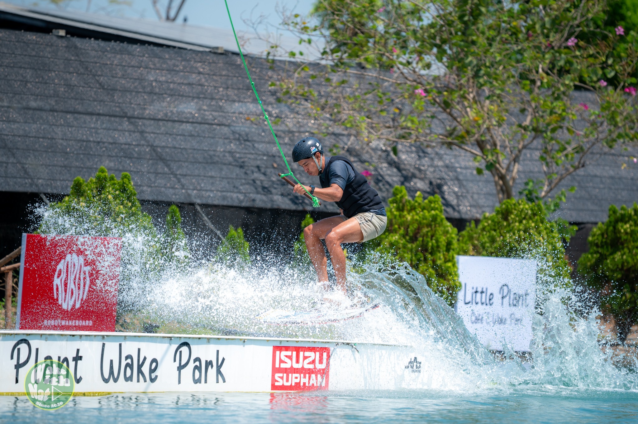 Splash shot - wakeboarder hitting a feature at Little Plant Wake Park