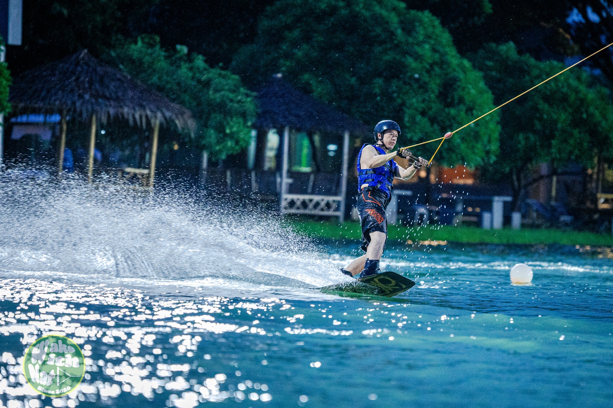 Aerial grab trick over the lake at TWP Lumlukka wakeboarding Thailand