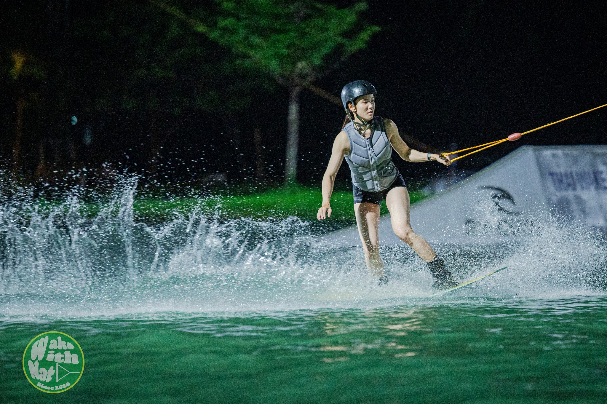 Aerial grab trick over the lake at TWP Lumlukka wakeboarding Thailand