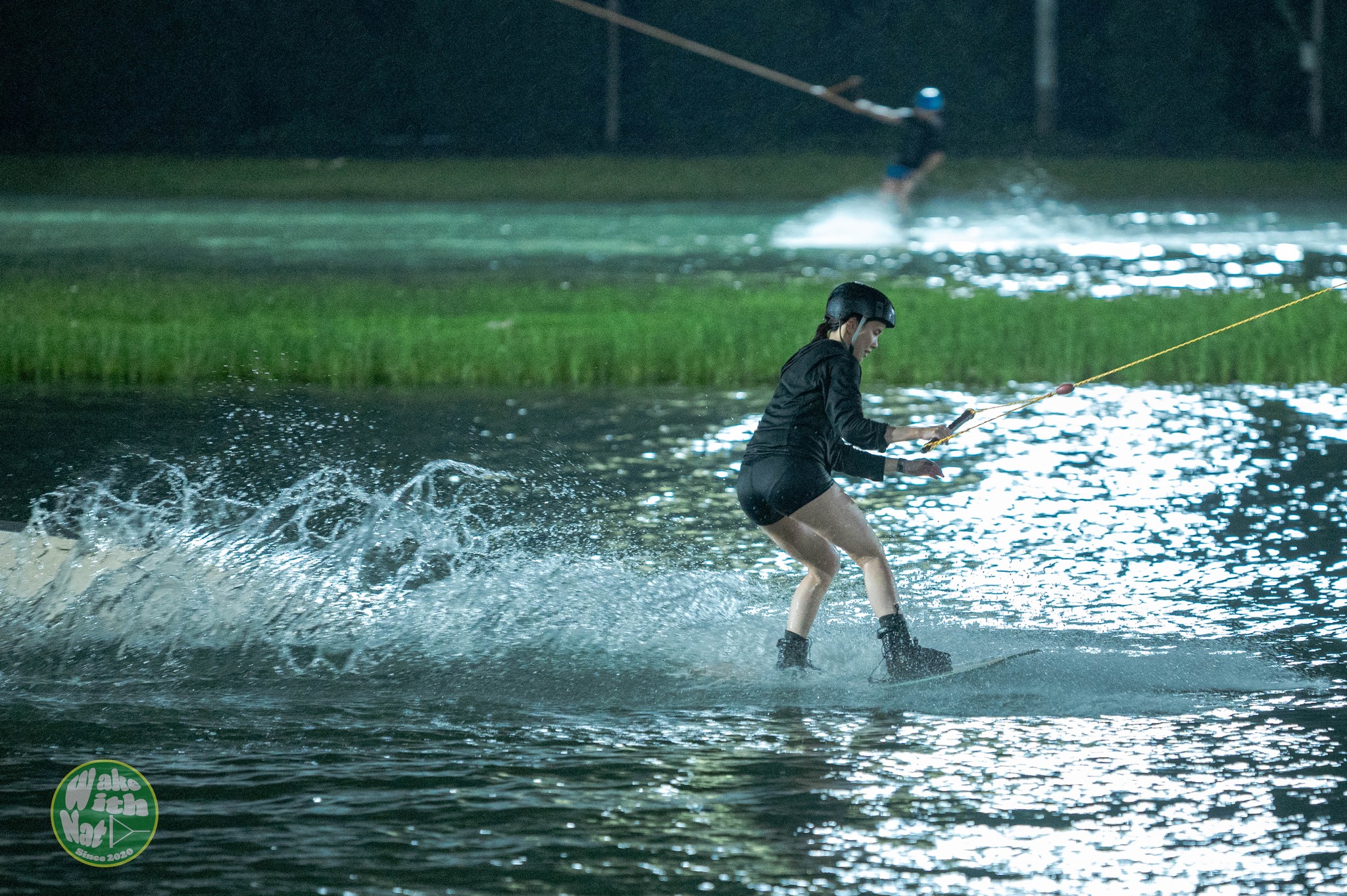 Atmosphere shot of wake riders waiting at Thai Wake Park Lumlukka dock