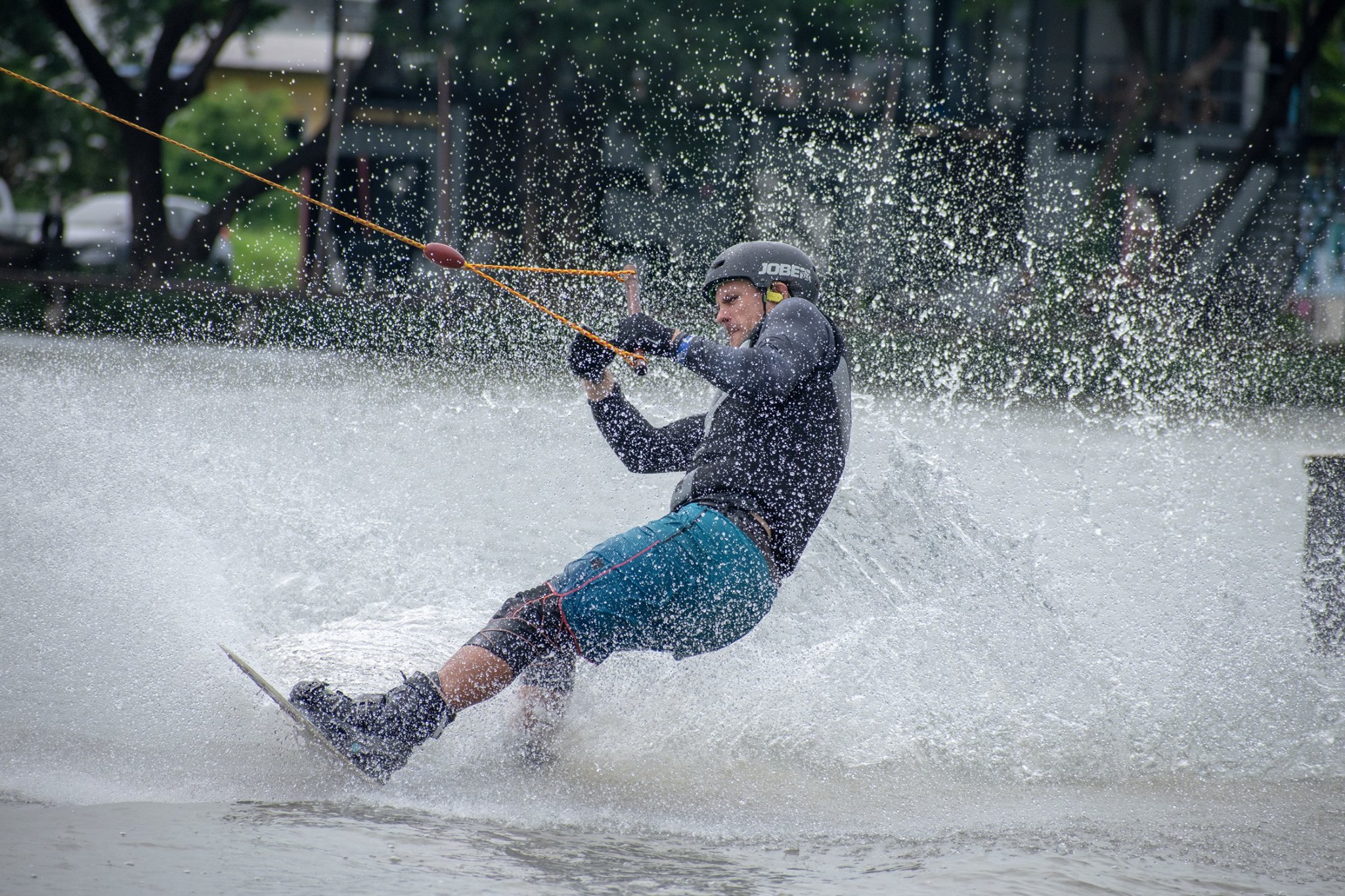 Wakeboarder launching off a kicker at Zanook Wake Park Thailand